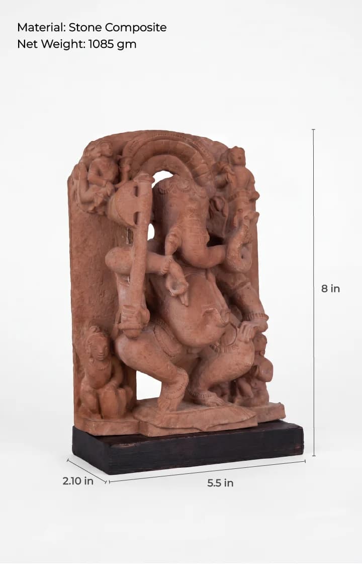A three-quarter view of the Ganesha Sculpture, a stone composite replica featuring detailed temple art carvings on a black base.