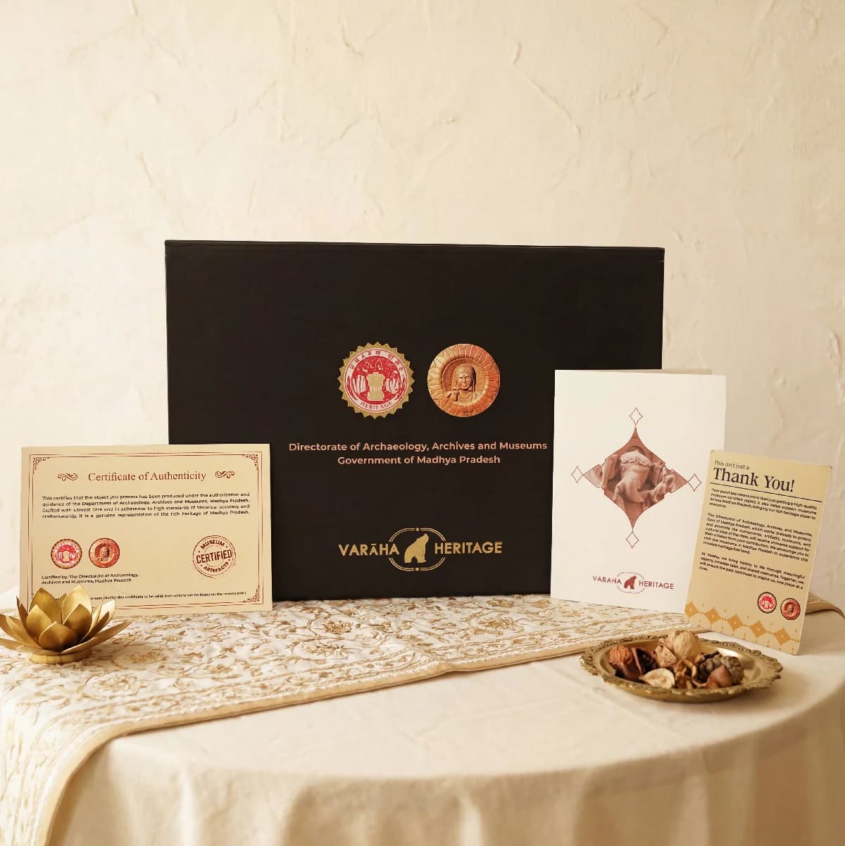 The Ganesha Sculpture packaging set includes a black presentation box, a certificate of authenticity, and a thank you card.