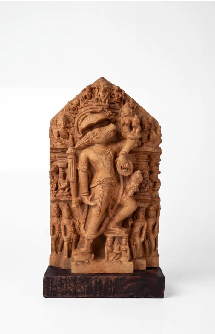 A detailed stone composite Nar Varaha Sculpture replica showing the man-boar deity rescuing Bhudevi with intricate temple carvings.