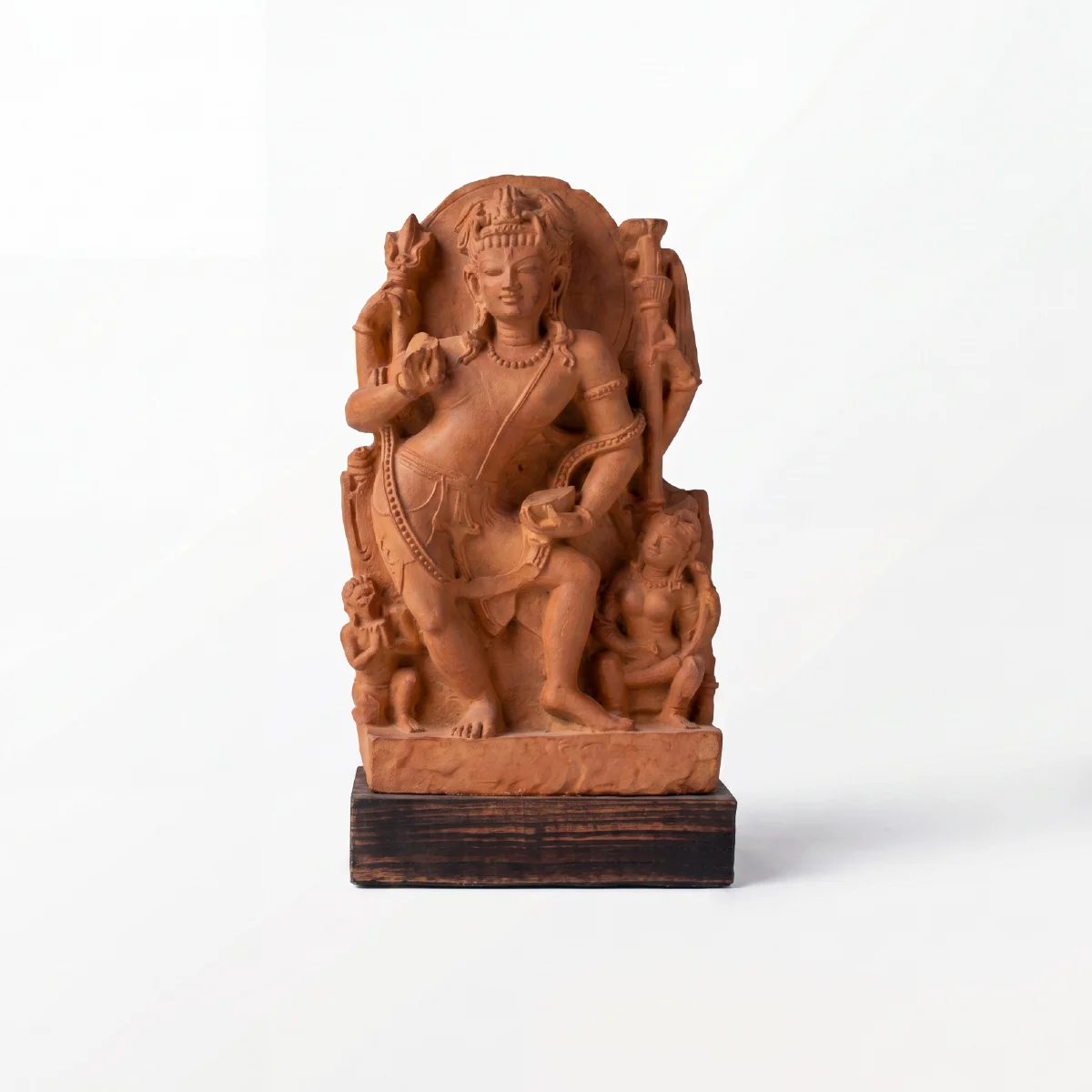 A front-facing view of the Natesh Shiva Sculpture, a stone composite replica featuring intricate carvings of the dancing deity.