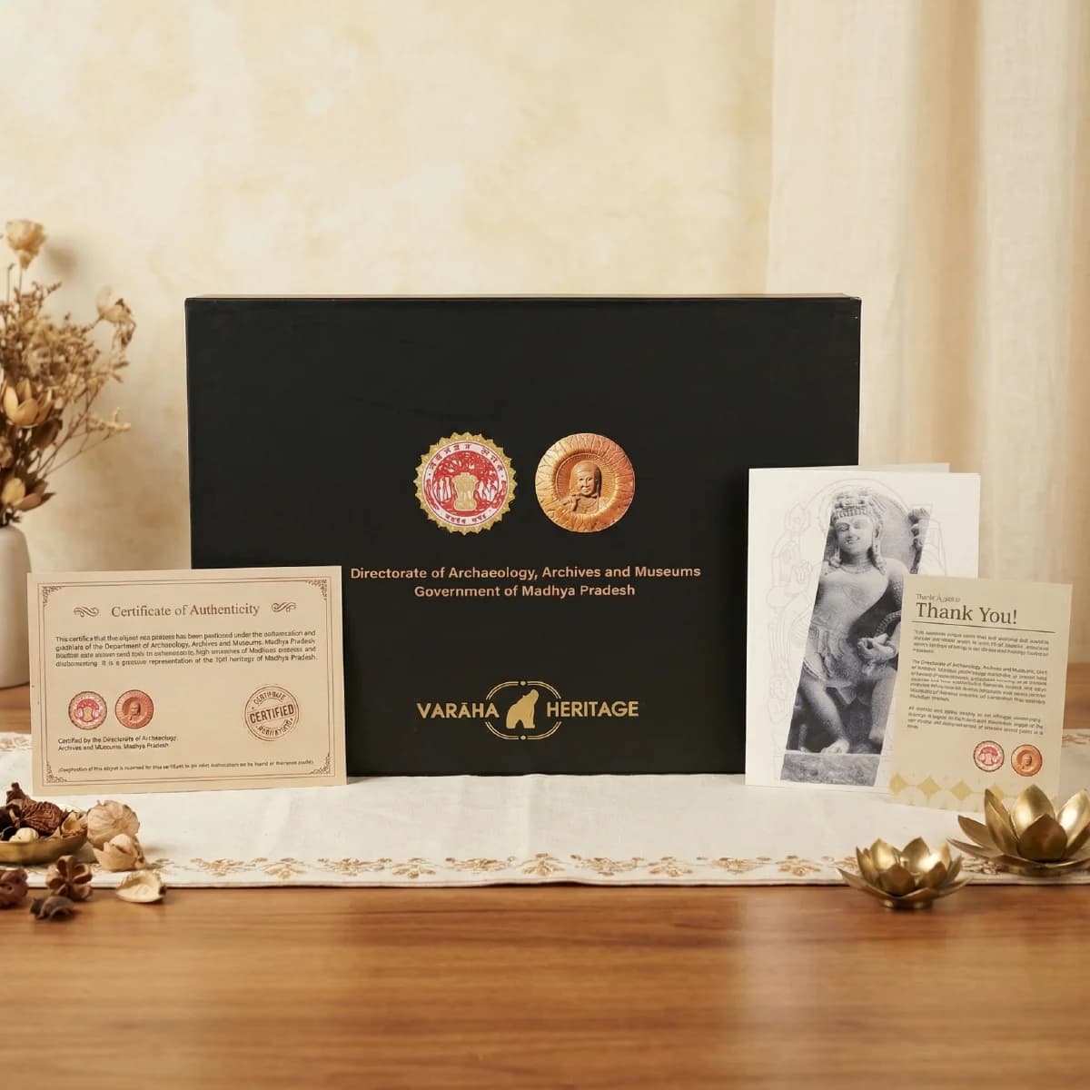 The Natesh Shiva Sculpture packaging box displayed with its official certificate of authenticity and a thank you card.