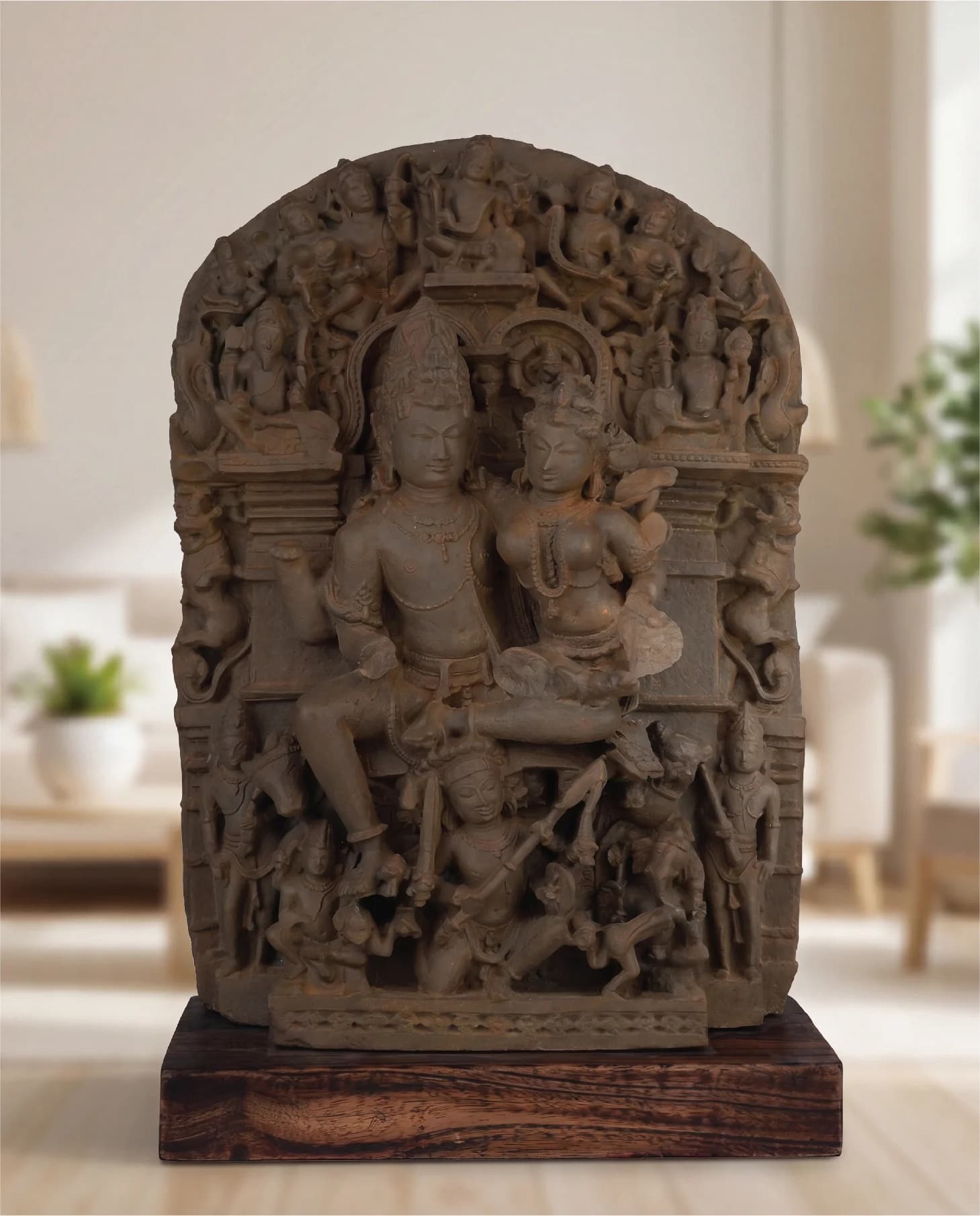 A front view of the Ravananugraha Sculpture, a hand-finished stone composite replica depicting Shiva and Parvati with intricate carvings.