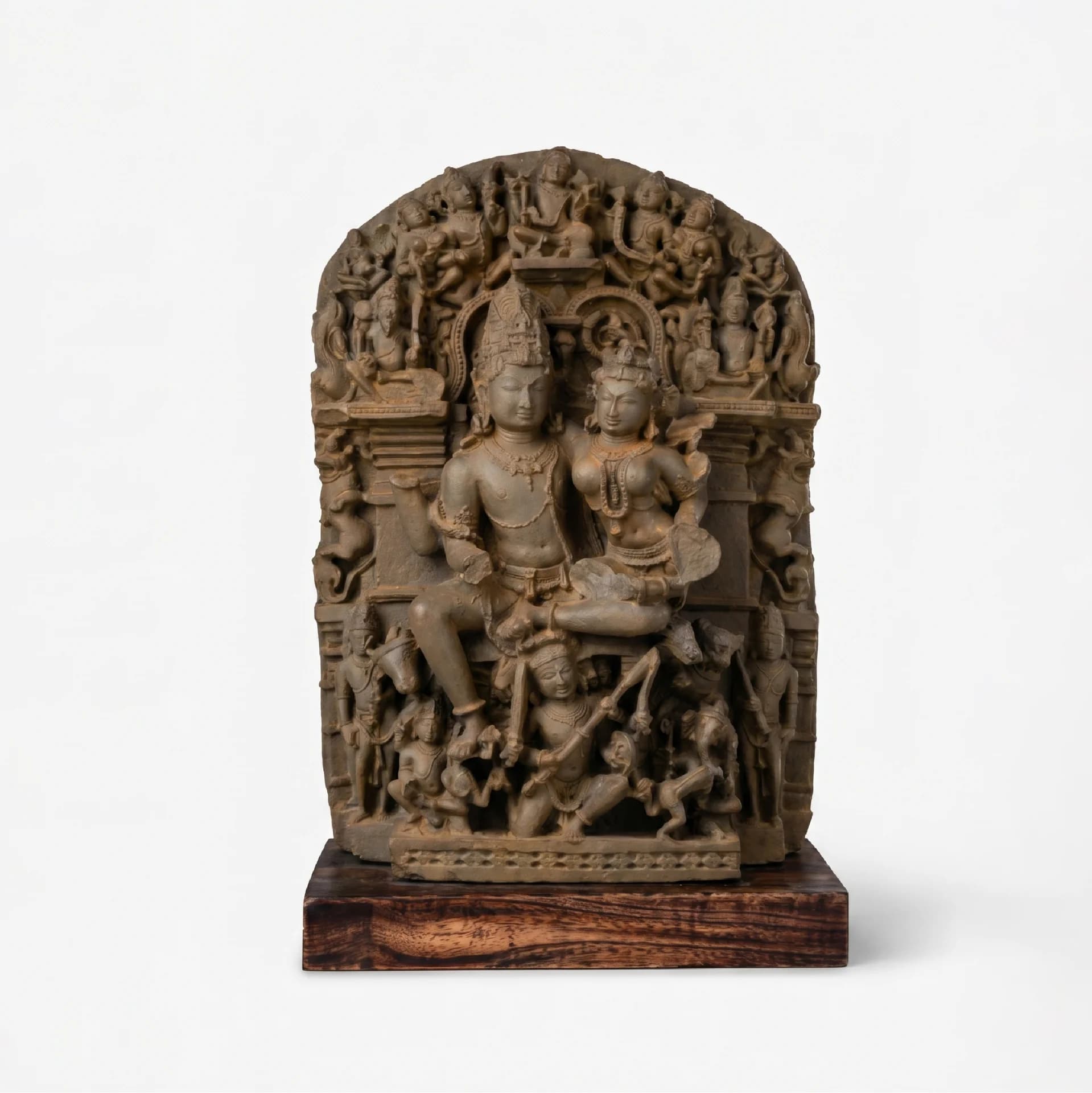 A full front view of the Ravananugraha Sculpture, a hand-finished stone composite replica featuring intricate divine figures on a teak base.