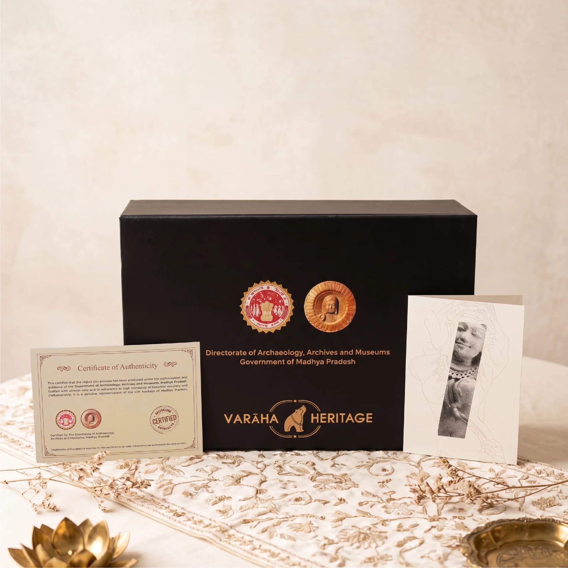 The Salabhanjika Sculpture packaging box displayed with its official certificate of authenticity and a decorative heritage art card.