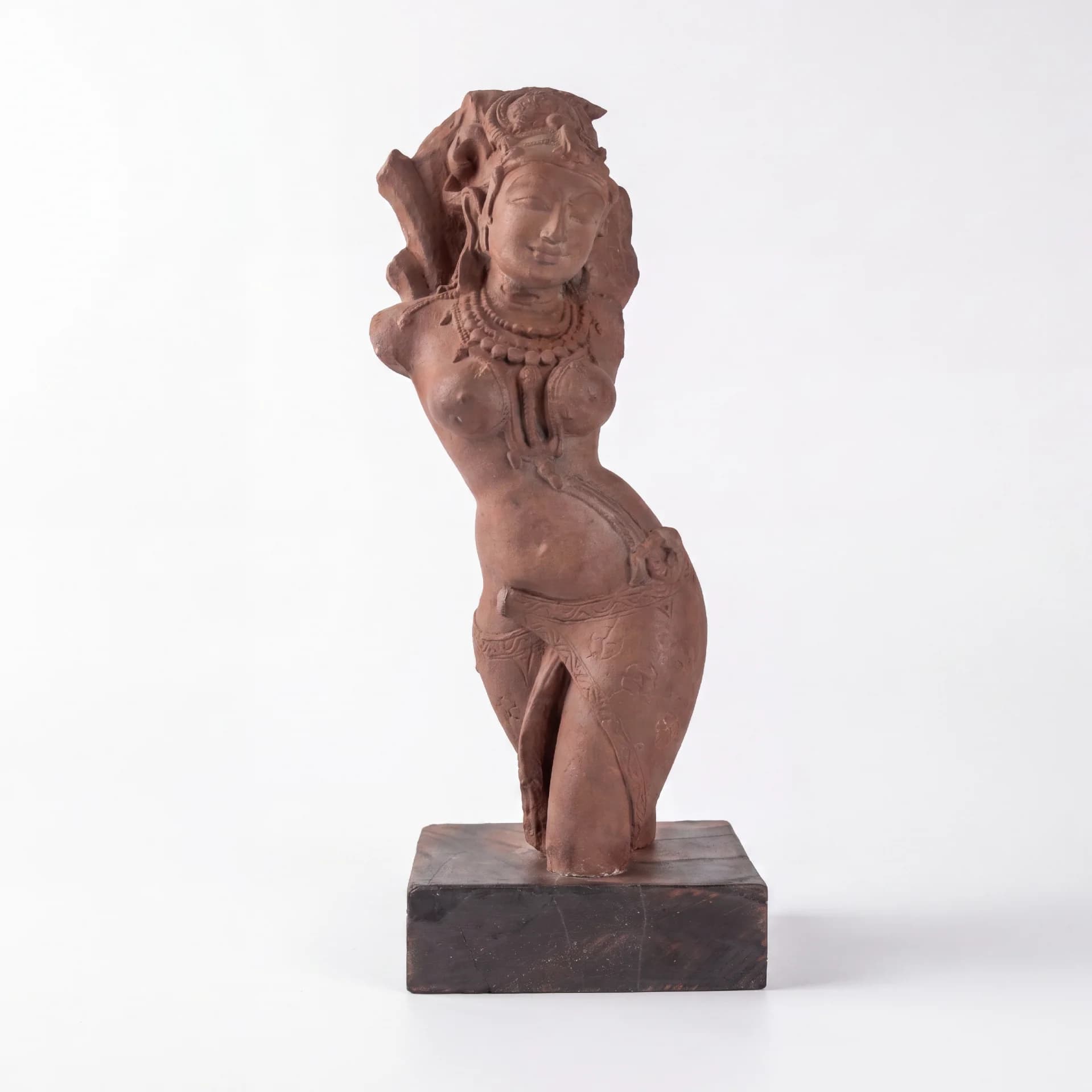 A full front view of the Salabhanjika Sculpture, a stone composite replica featuring an elegant tribhanga pose on a wooden base.