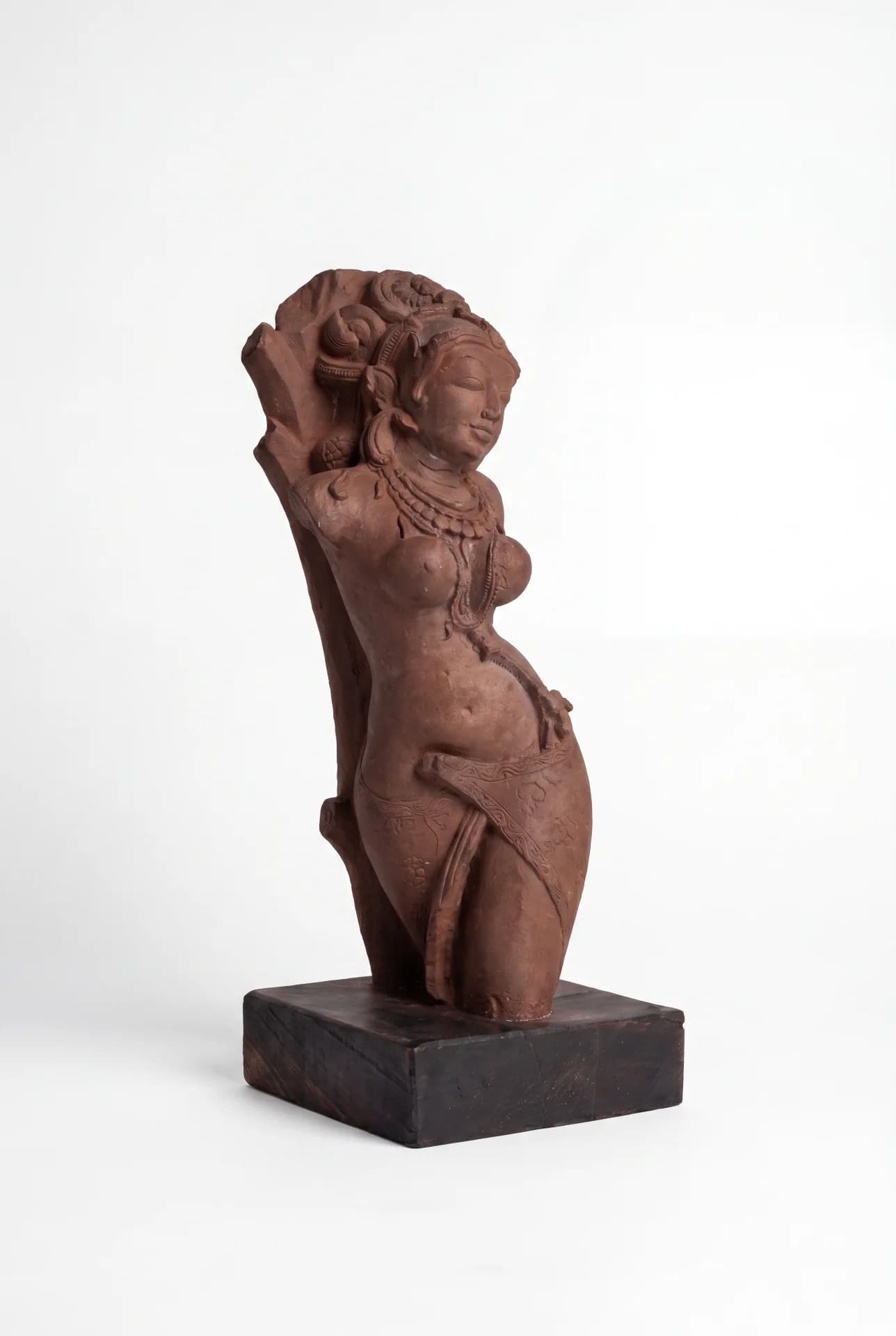 A three-quarter view of the Salabhanjika Sculpture, a stone composite replica featuring an elegant figure in a traditional tribhanga pose.