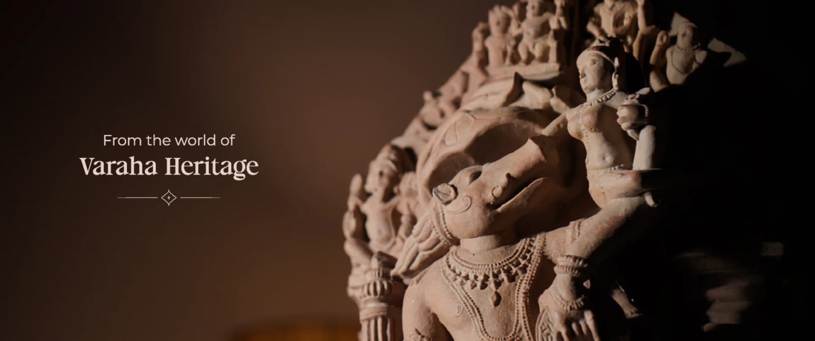 A close-up view of the Test-BOM sandstone sculpture, highlighting the intricate carved figures of the 10th century deity.