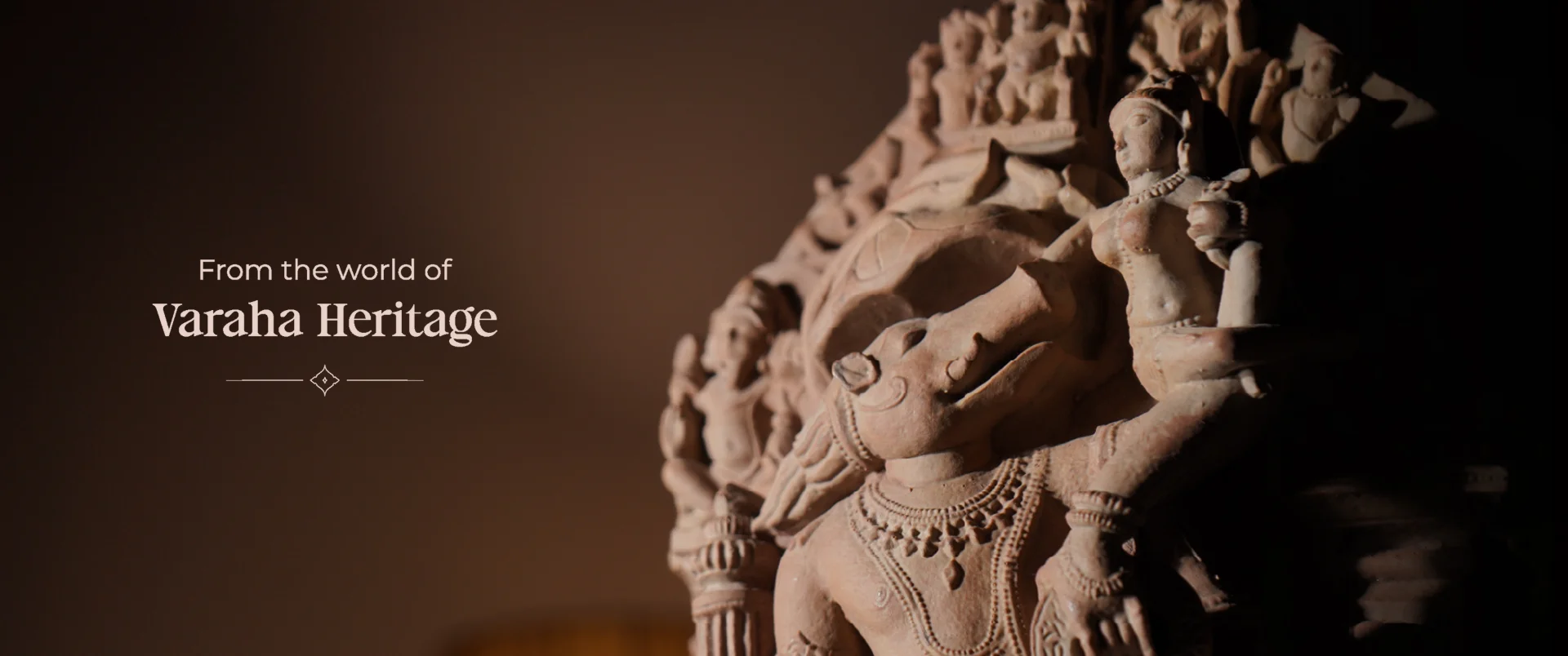 A close-up view of the Test-BOM sandstone sculpture, highlighting the intricate carved figures of the 10th century deity.