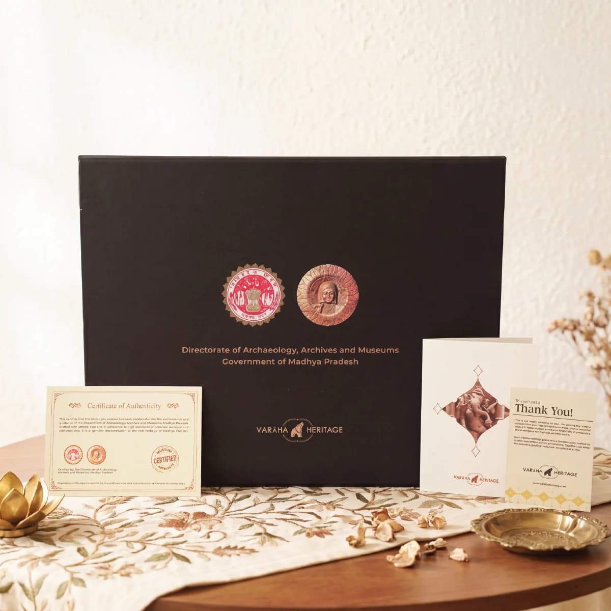 The Vinayaki Sculpture packaging box displayed alongside its official certificate of authenticity and a thank you note.