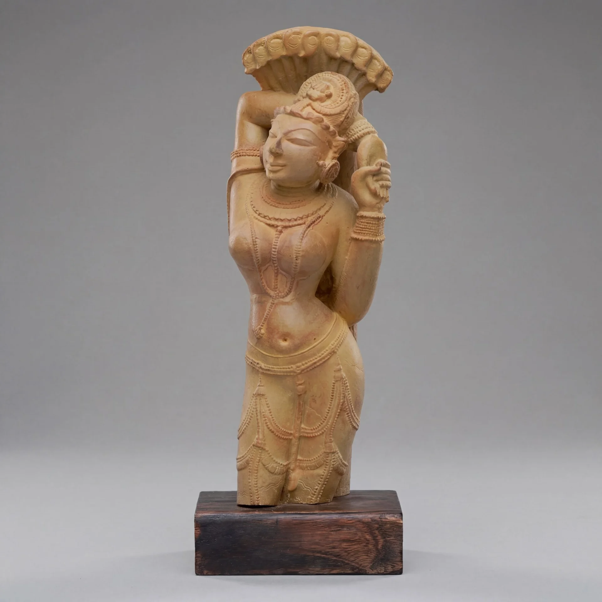 The Alasa Nayika Sculpture replica features a sandstone-textured female figure in a graceful tribhanga pose on a black base.