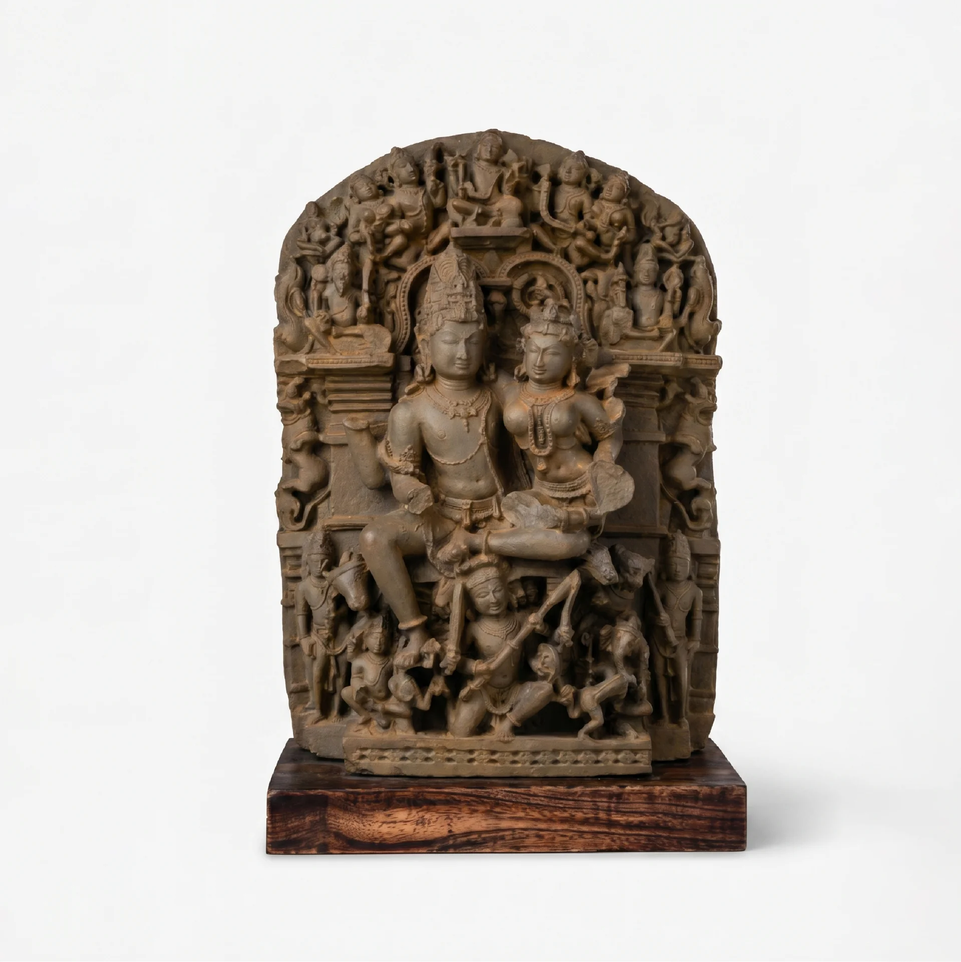 A full front view of the Ravananugraha Sculpture, a hand-finished stone composite replica featuring intricate divine figures on a teak base.