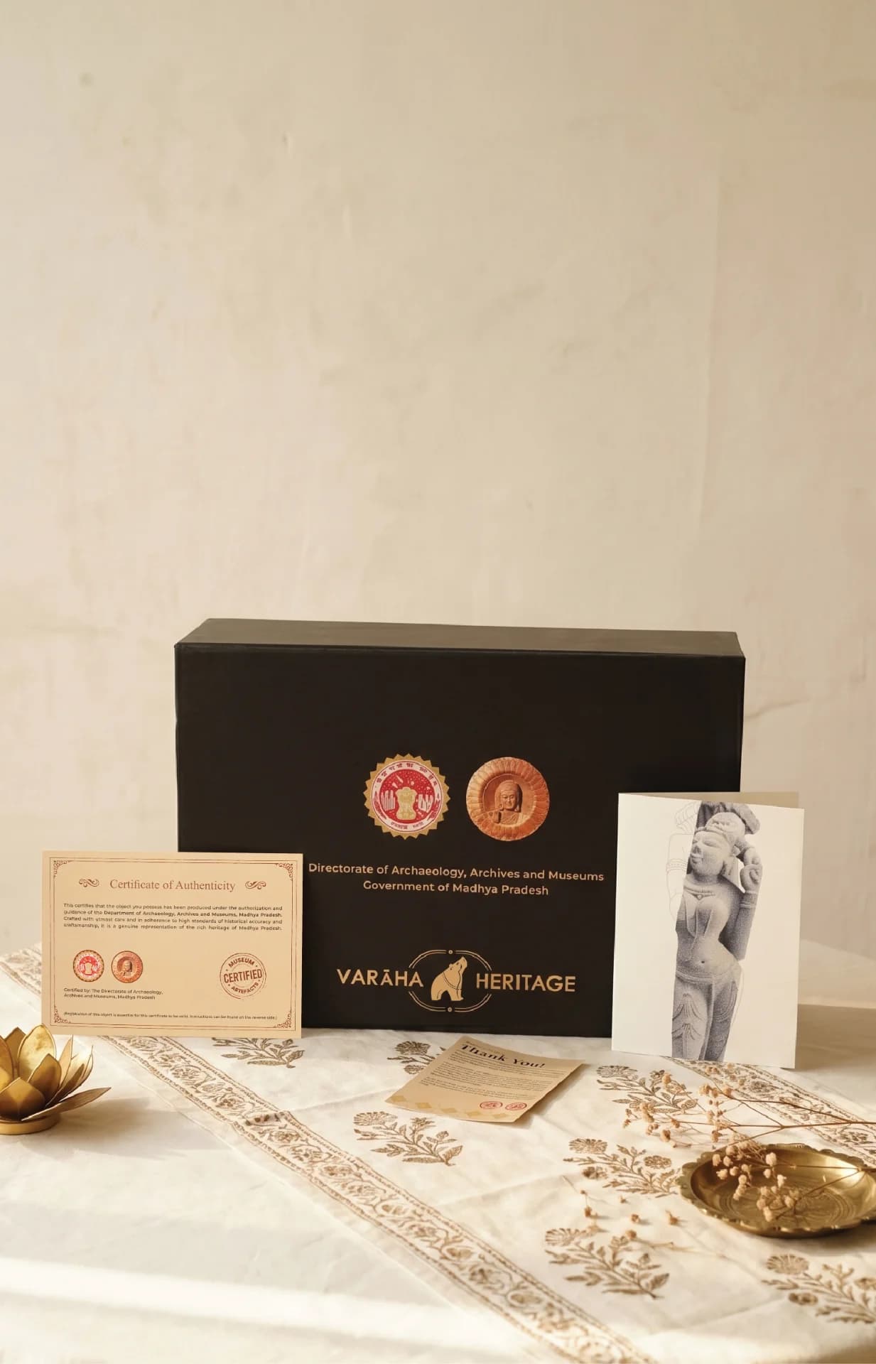 The Alasa Nayika Sculpture packaging set includes a black presentation box, a certificate of authenticity, and an informational card.