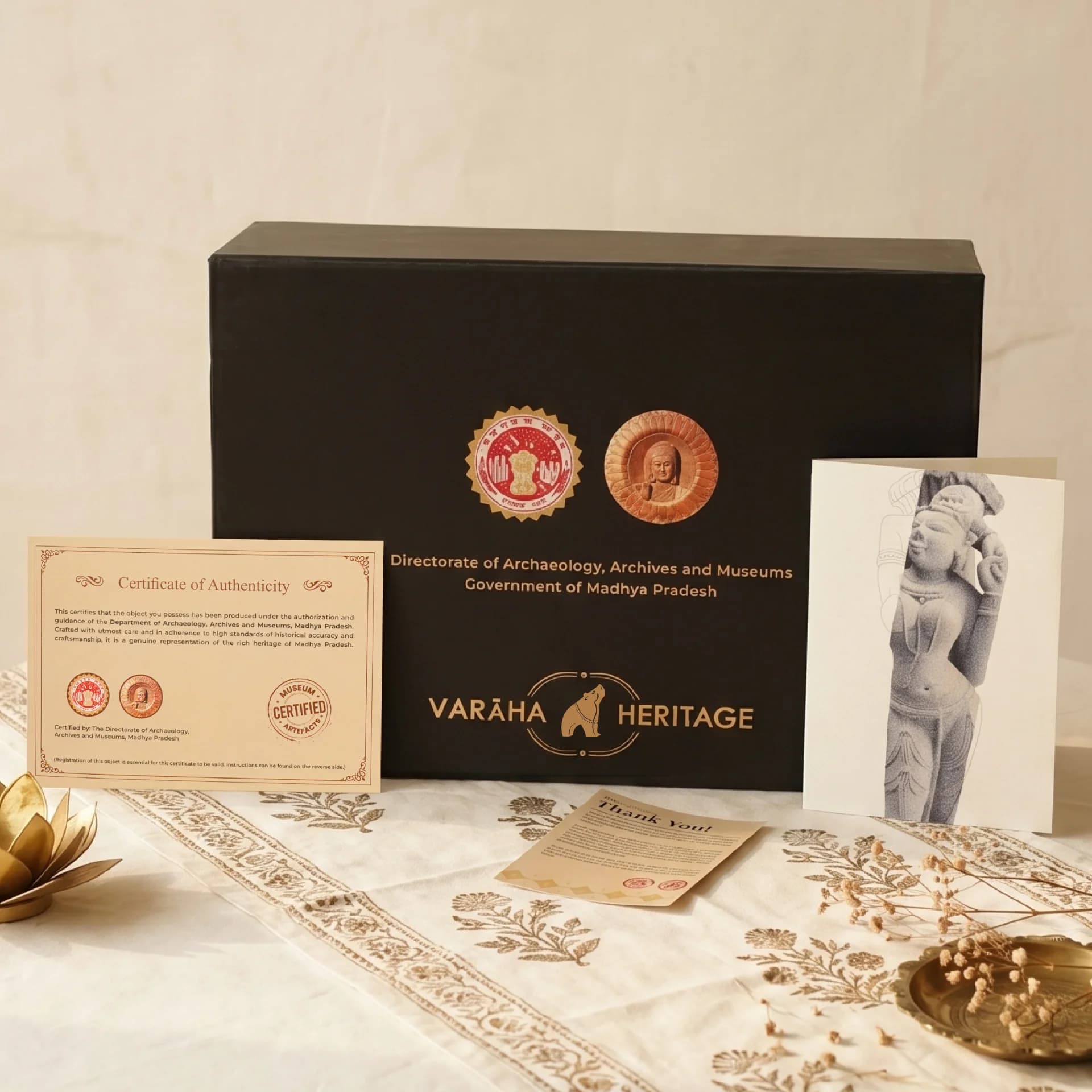 The Alasa Nayika Sculpture packaging set includes a black presentation box, a certificate of authenticity, and an illustrated information card.
