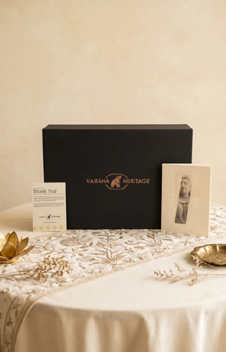 A black gift box featuring the Female Figure Bust Sculpture branding alongside a thank you note on a table.