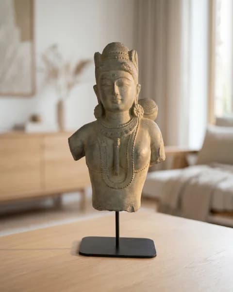 A Female Figure Bust Sculpture in Chola style, hand-finished in stone composite, displayed on a black metal stand.