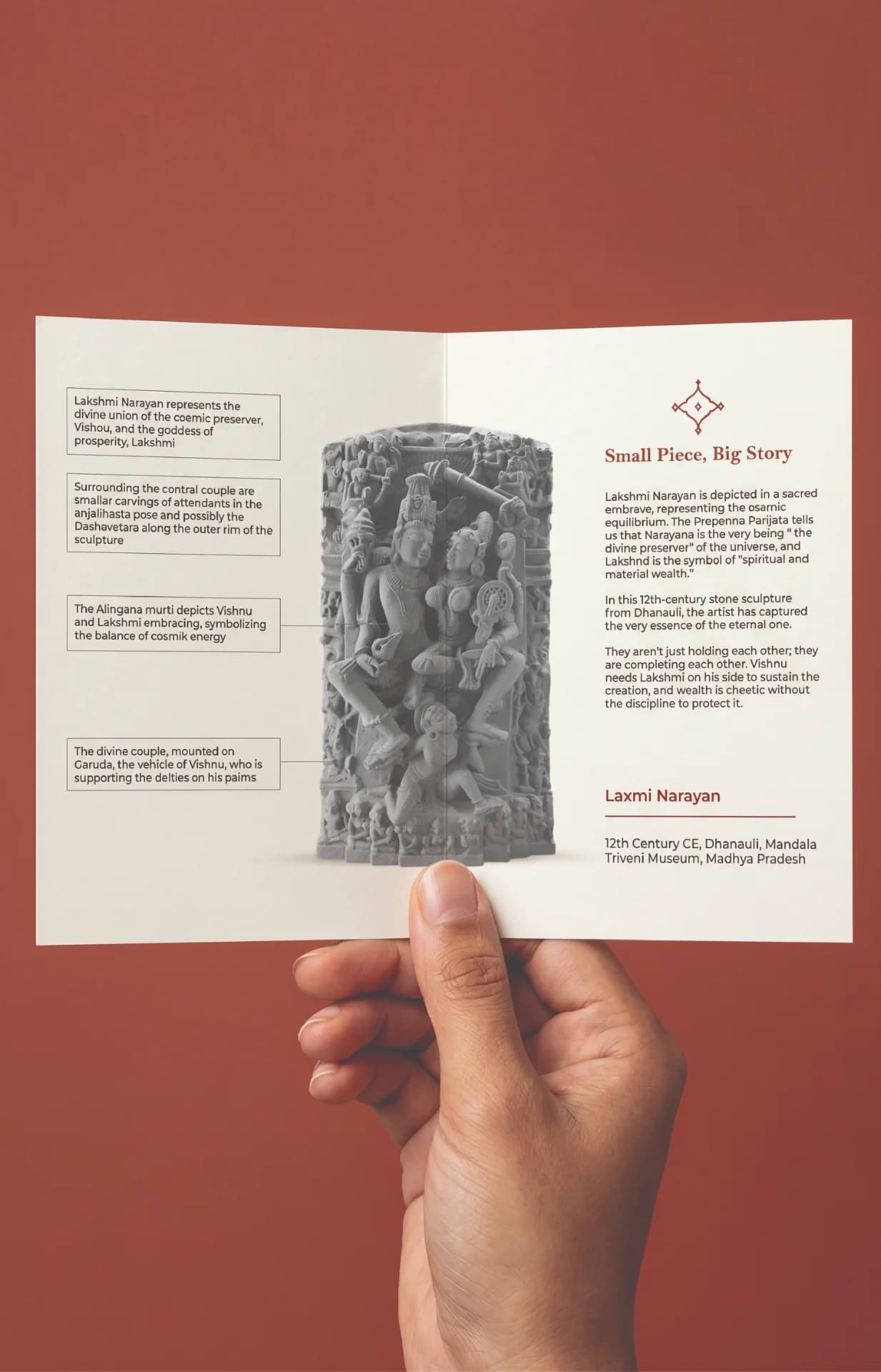 A hand holds an informational brochure featuring the Lakshmi Narayan Sculpture, a detailed stone-style replica with historical context and descriptive annotations.