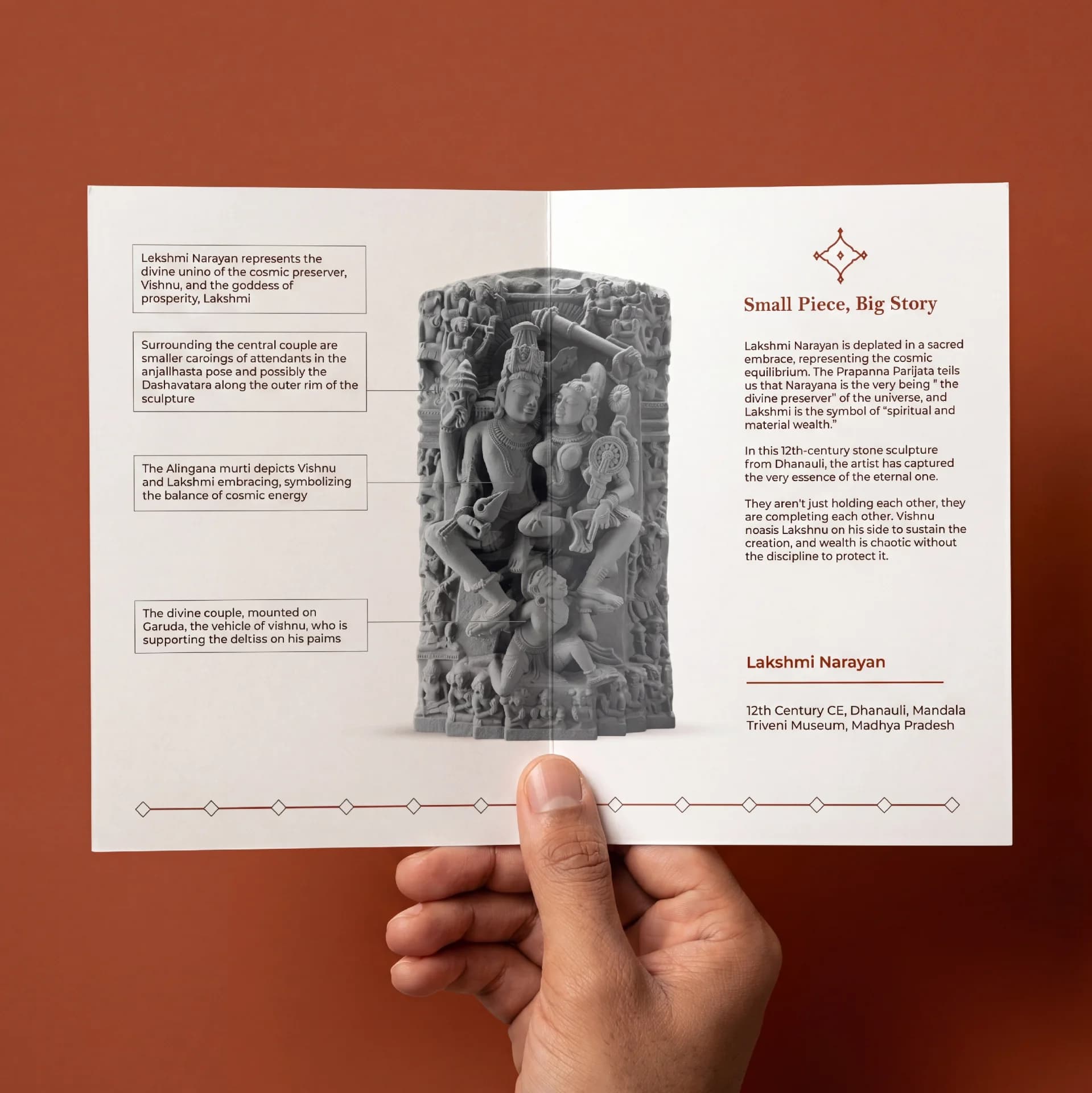 A hand holds an open brochure featuring the Lakshmi Narayan Sculpture 12th Century replica with detailed informational annotations and historical context.