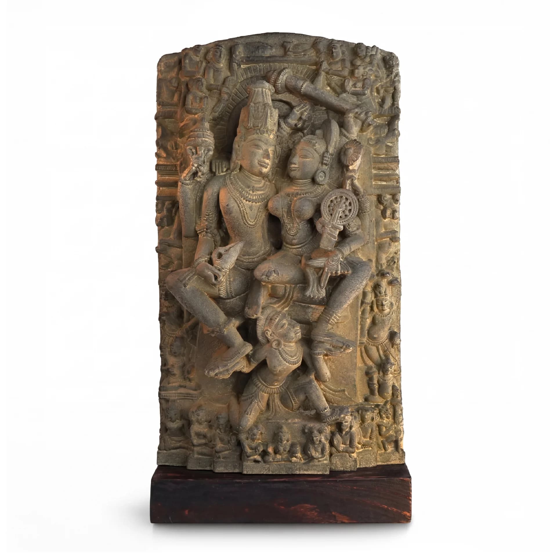 A front-facing view of the Lakshmi Narayan Sculpture, a hand-finished stone-style replica featuring intricate 12th-century divine iconography on a wooden base.