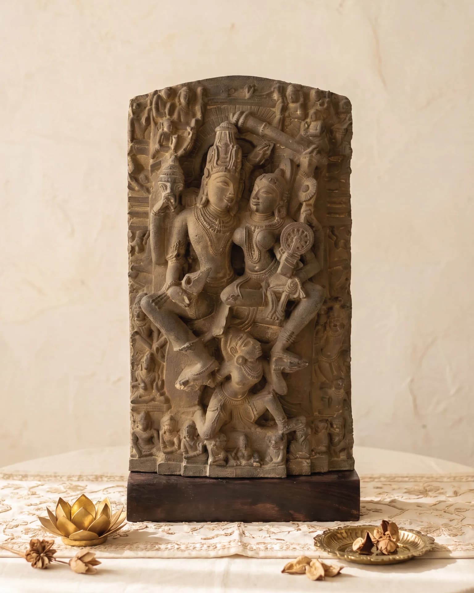 A front-facing view of the Lakshmi Narayan Sculpture, a hand-finished stone-style replica featuring intricate 12th-century divine iconography.