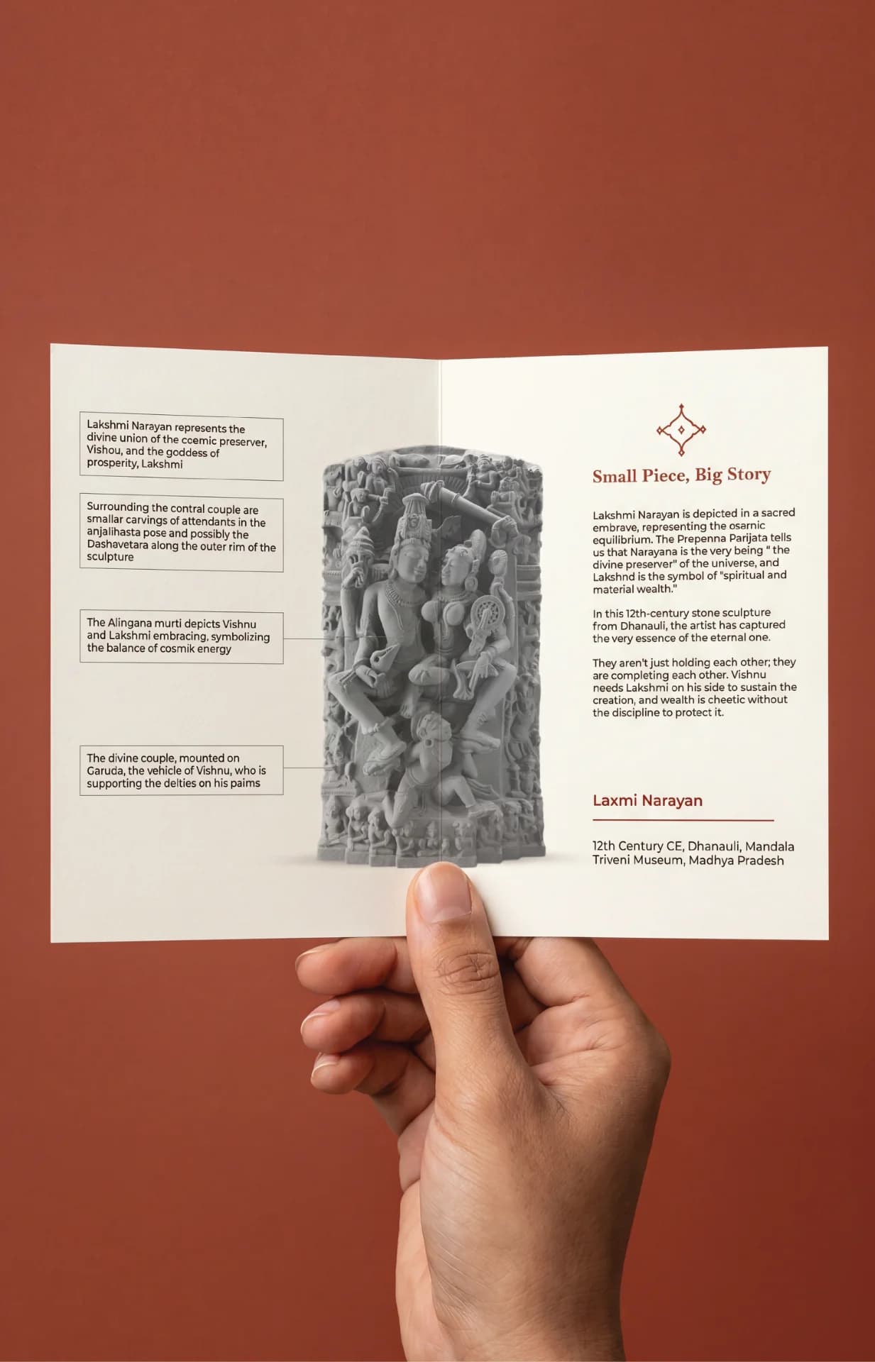 A hand holds an informational brochure featuring a detailed stone-style Lakshmi Narayan Sculpture replica with descriptive historical annotations.