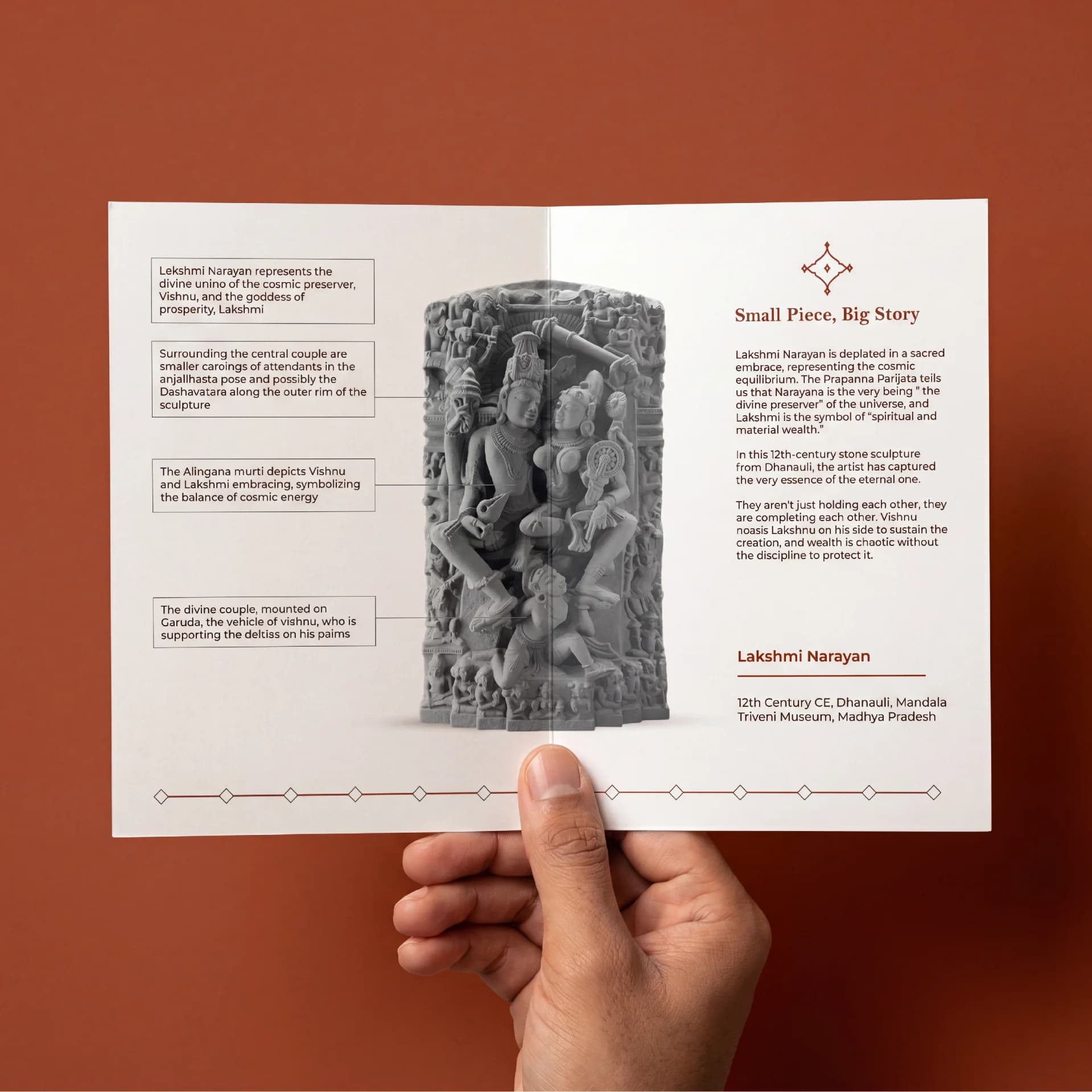 A hand holds an informational brochure featuring the Lakshmi Narayan Sculpture, showcasing detailed stone-finish imagery and historical context text.
