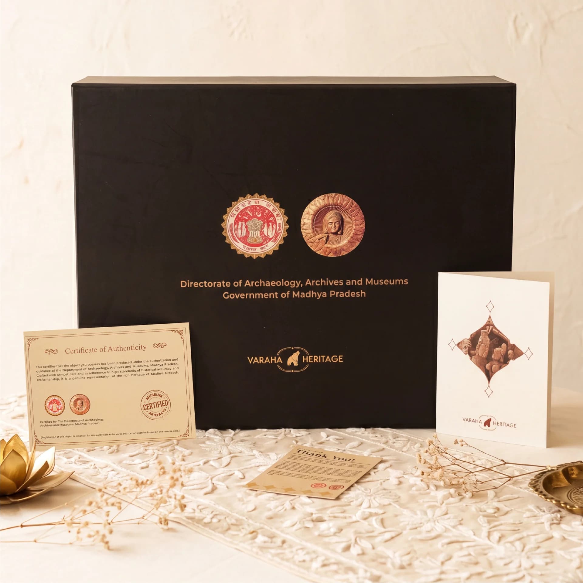 A black presentation box for the Lakshmi Narayan Sculpture, featuring an official government certificate of authenticity and a branded information card.