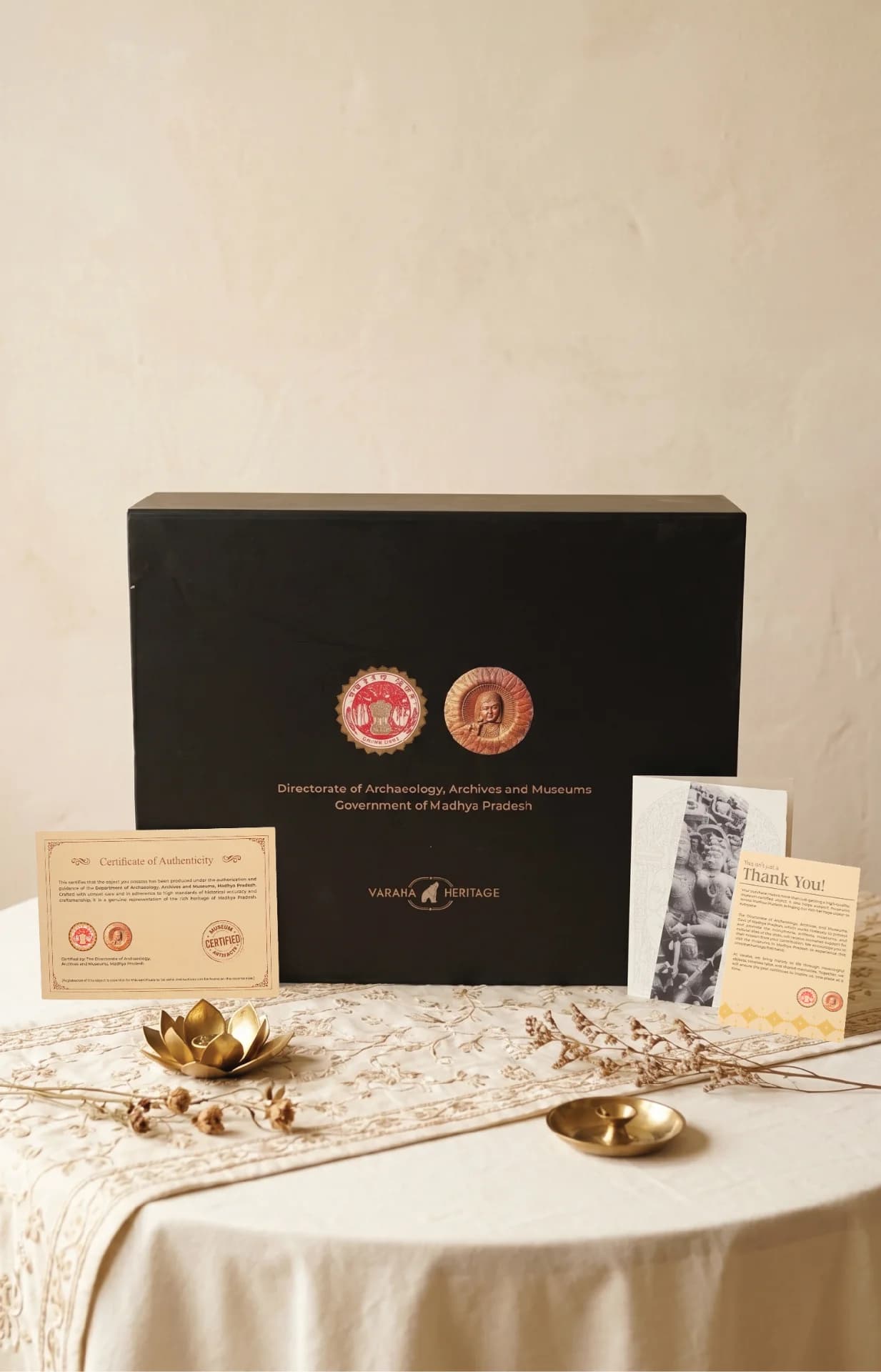 The Ravananugraha Sculpture packaging box displayed with its official certificate of authenticity and a thank you note.